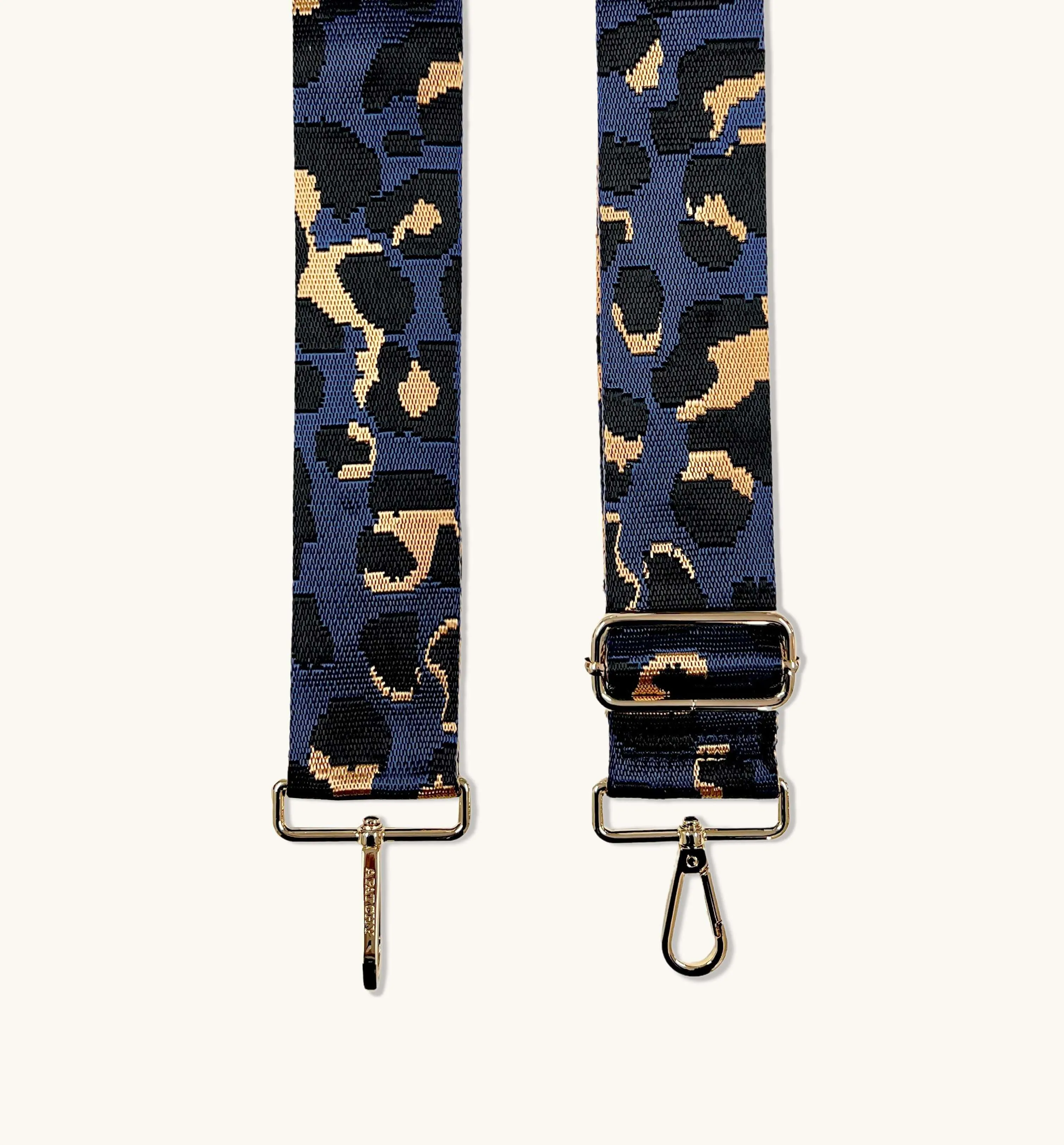 The Tassel Black Leather Crossbody Bag With Navy Leopard Strap